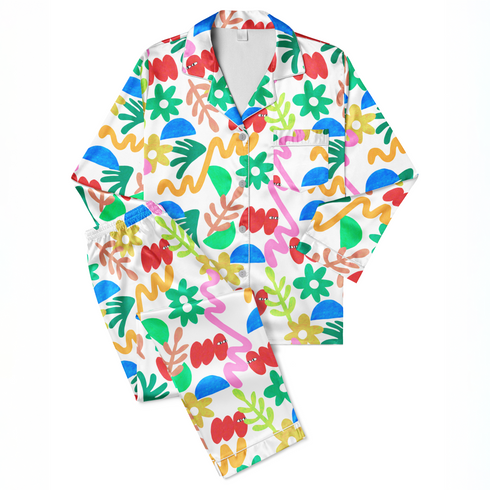 Collage colorido con formas abstractas: flores amarillas, semicírculos azules, líneas onduladas y elementos orgánicos en diversos colores brillantes. sutex pajamas fullview mockup