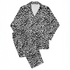 Patrón de leopardo negro sobre fondo blanco con manchas irregulares distribuidas verticalmente sutex pajamas fullview mockup