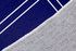 Texto blanco "Nuestro hogar" con flechas decorativas sobre fondo azul marino con marco doble sutex rug 2x3 closeup texture angled