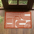 Diseño gráfico geométrico con líneas blancas y formas redondeadas sobre fondo terracota