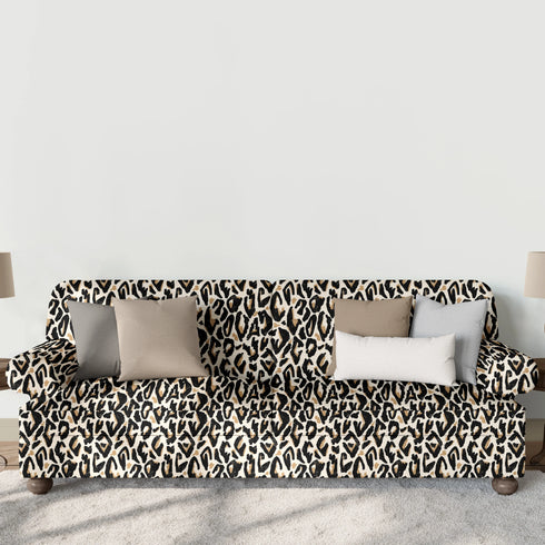 Estampado abstracto negro y dorado con formas orgánicas irregulares sobre fondo crema sutex sofa mockup