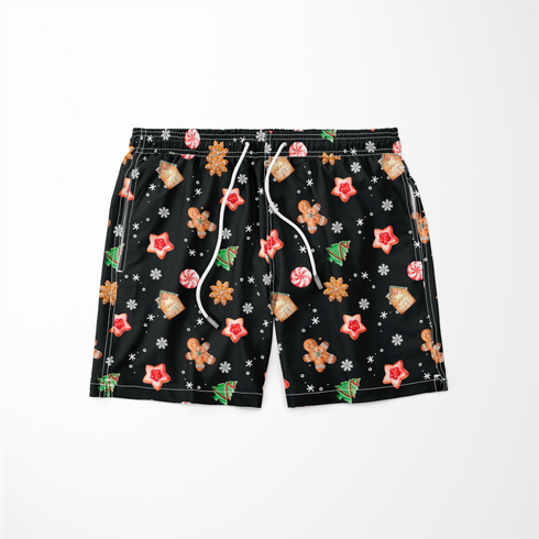 Patrón navideño con galletas decoradas en forma de estrellas, copos de nieve, árbol, casa y muñeco de jengibre sobre fondo negro. sutex swimtrunks