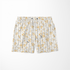 Patrón floral delicado con flores amarillas y hojas grises sobre rayas verticales en fondo crema sutex swimtrunks