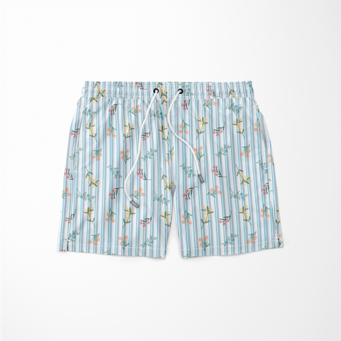 Patrón floral con líneas verticales en tonos azules, flores rosadas y amarillas sobre fondo rayado sutex swimtrunks