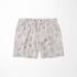 Patrón de líneas rosado pálido con flores estilizadas beige sobre fondo rayado vertical sutex swimtrunks