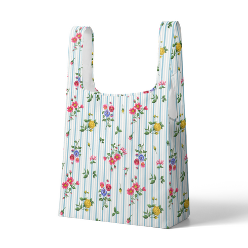 Patrón floral con rosado, amarillo y azul sobre rayas verticales azules y blancas sutex tote mockup
