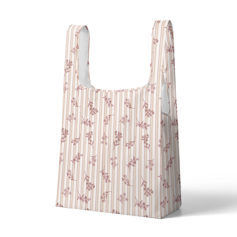 Patrón de rayas verticales en tonos rosado pálido y crema con delicados motivos florales de ramas y hojas sutex tote mockup