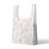 Patrón floral con flores rosado pálido sobre fondo de rayas verticales en tonos crema y beige sutex tote mockup