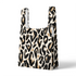 Estampado abstracto negro y dorado con formas orgánicas irregulares sobre fondo crema sutex tote mockup