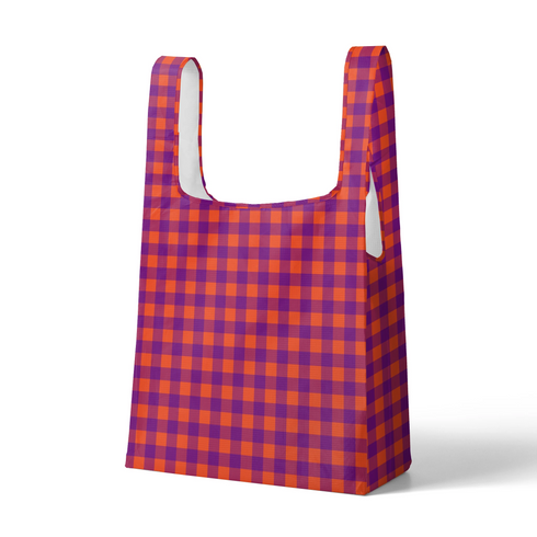 Patrón de cuadros en tonos morado, naranja y vino tinto con diseño geométrico repetitivo