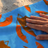 Hojas de Palmera Naranja con Azul Toalla Viajera