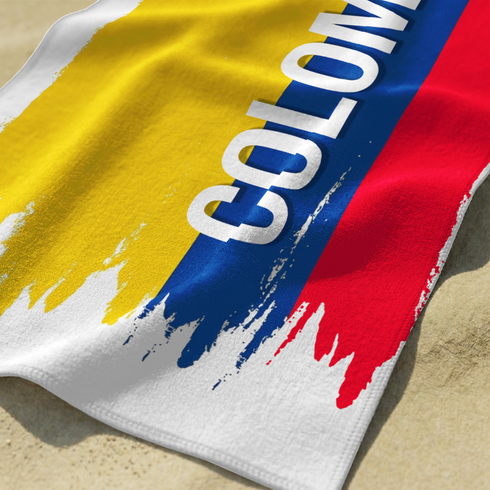 Bandera de Colombia con texto invertido "COLOMBIA" en azul sobre franjas rojo, azul y amarillo sutex towel closeup