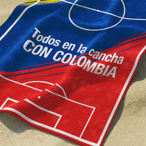 Cancha de fútbol con colores de la bandera colombiana: amarillo, azul y rojo con texto promocional sutex towel closeup
