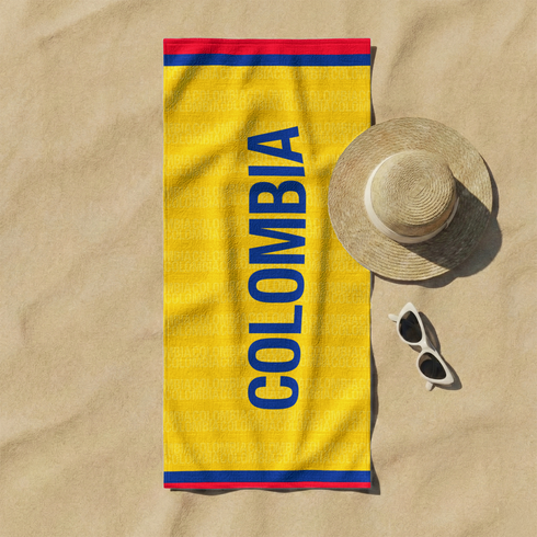 Bandera amarilla con texto azul "COLOMBIA" invertido, bordes rojos laterales sutex towel fullview