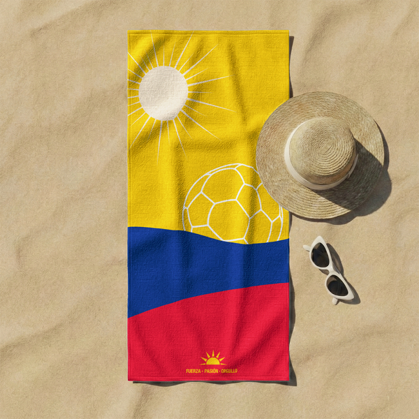 Bandera colombiana estilizada con balón de fútbol amarillo bajo sol radiante sobre franjas azul y roja sutex towel fullview