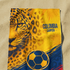 Diseño deportivo Colombia con jaguar estampado, balón de fútbol, colores amarillo azul rojo, patrones geométricos sutex towel medium