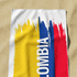 Bandera de Colombia con texto invertido "COLOMBIA" en azul sobre franjas rojo, azul y amarillo sutex towel medium