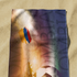 Portero de fútbol saltando hacia balón con resplandor dorado, silueta dramática en tonos azul y naranja sutex towel medium