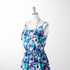 Patrón abstracto en tonos azul, turquesa, rosa y blanco con formas orgánicas superpuestas. sutex woven dress form mockup