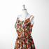 Estampado abstracto con manchas de leopardo en naranja, negro, blanco y café sutex woven dress form mockup