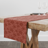 Red-brown floral pattern with abstract flowers on a lighter coral background table runner mockup