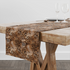 Estampado animal print con leopardo, serpientes y motivos abstractos en tonos café, negro y crema table runner mockup
