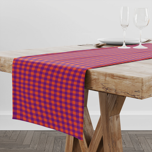 Patrón de cuadros en tonos morado, naranja y vino tinto con diseño geométrico repetitivo